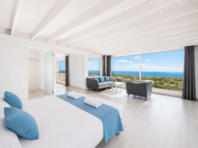 Double bedroom with en suite bathroom, A/C, living area, and sea views . - The View . (Photo Gallery) }}