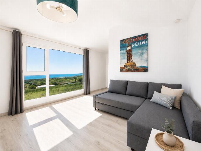 Double bedroom with en suite bathroom, A/C, living area, and sea views . - The View . (Photo Gallery) }}