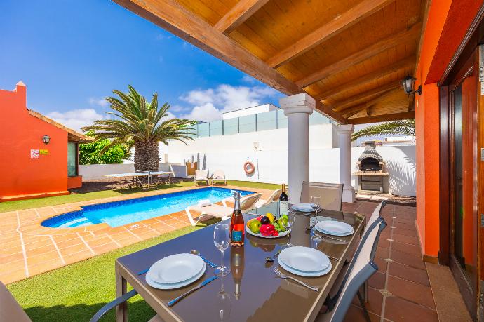 Sheltered terrace area . - Villa Brisa del Mar 12 . (Photo Gallery) }}