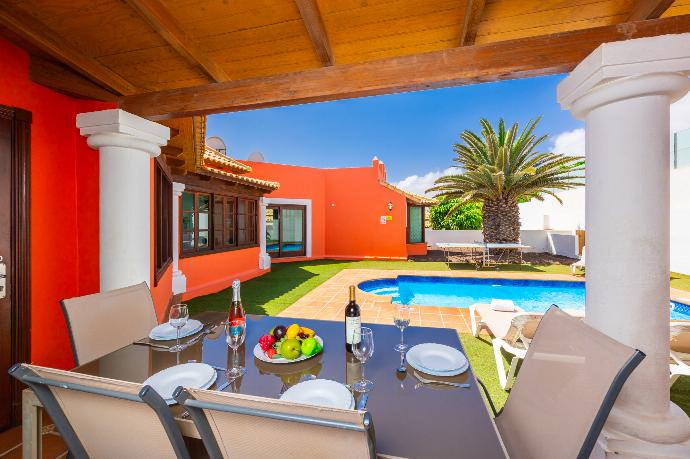 Sheltered terrace area . - Villa Brisa del Mar 12 . (Photo Gallery) }}