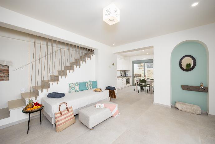 Open-plan living room with sofa, dining are, kitchen, A/C, WiFi internet, and satellite TV . - Villa Erofili . (Photo Gallery) }}