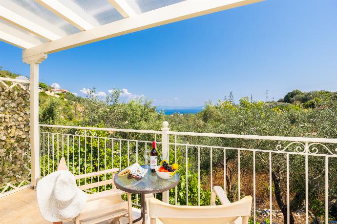 Sheltered terrace area with sea views . - Villa Magda Dione . (Photo Gallery) }}