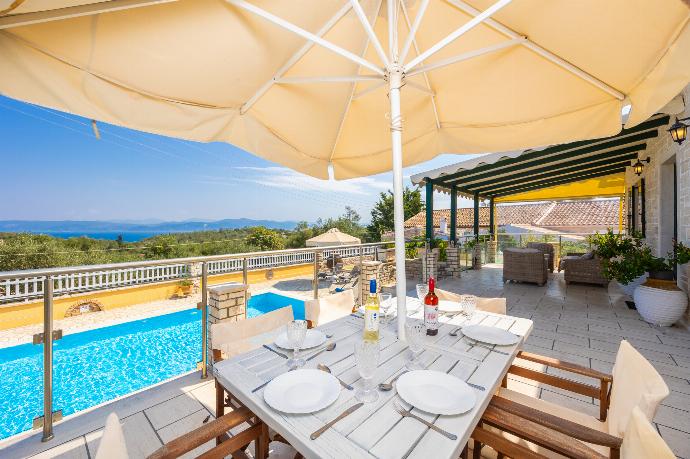 Terrace area with sea views . - Villa Afroditi . (Photo Gallery) }}