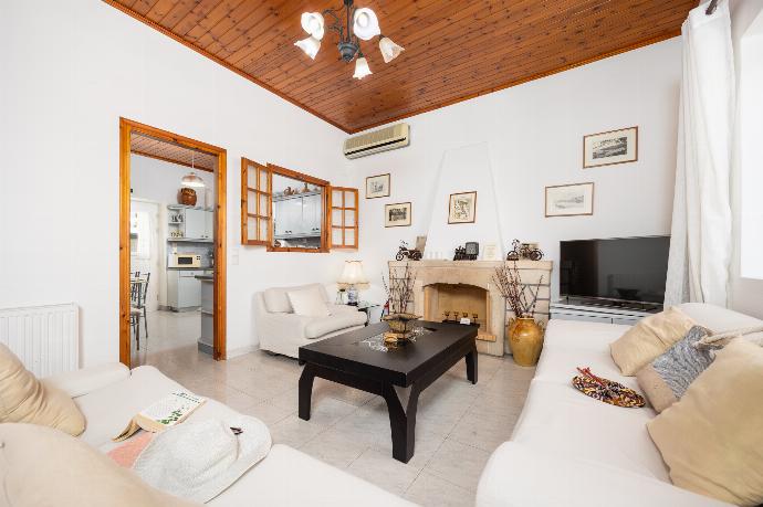 Living room with sofas, dining area, A/C, WiFi internet, and satellite TV . - Villa Afroditi . (Photo Gallery) }}