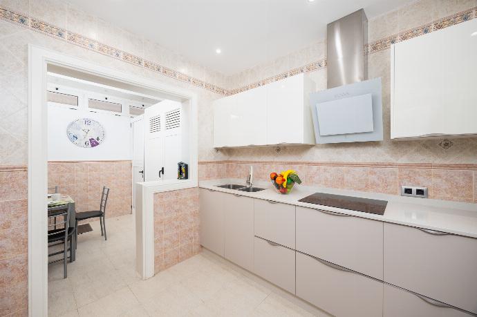 Equipped kitchen with dining area . - Villa Vista Calao . (Photo Gallery) }}