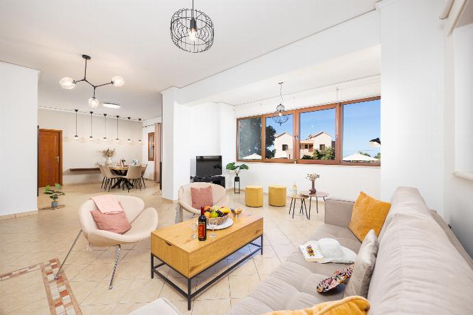 Living room with sofa, ornamental fireplace, A/C, WiFi internet, and satellite TV . - Villa Aspa . (Photo Gallery) }}