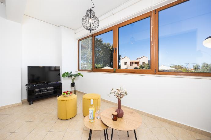 Living room with sofa, ornamental fireplace, A/C, WiFi internet, and satellite TV . - Villa Aspa . (Photo Gallery) }}