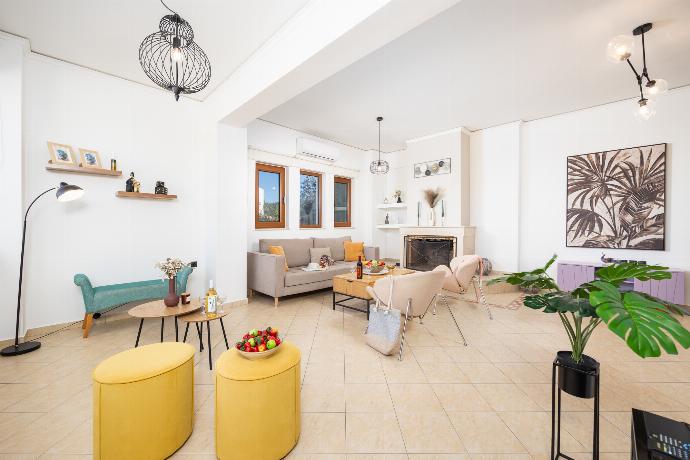 Living room with sofa, ornamental fireplace, A/C, WiFi internet, and satellite TV . - Villa Aspa . (Photo Gallery) }}