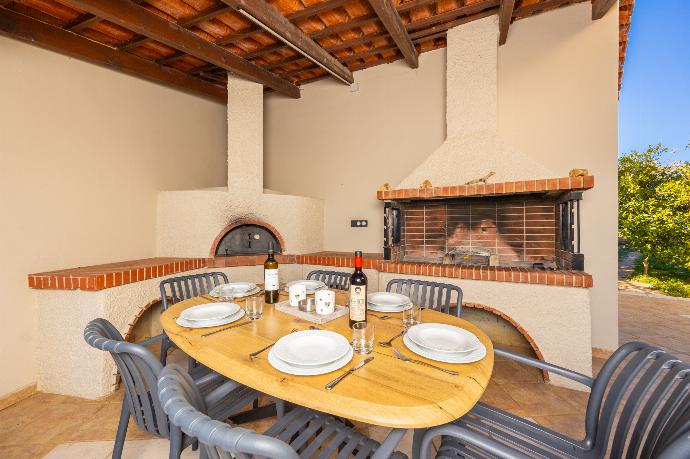 Sheltered terrace area with BBQ . - Villa Filia . (Photo Gallery) }}