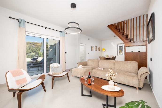 Living room with sofa, dining area, A/C, WiFi internet, and satellite TV . - Villa Filia . (Photo Gallery) }}