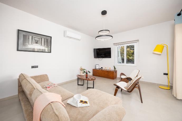 Living room with sofa, dining area, A/C, WiFi internet, and satellite TV . - Villa Filia . (Photo Gallery) }}