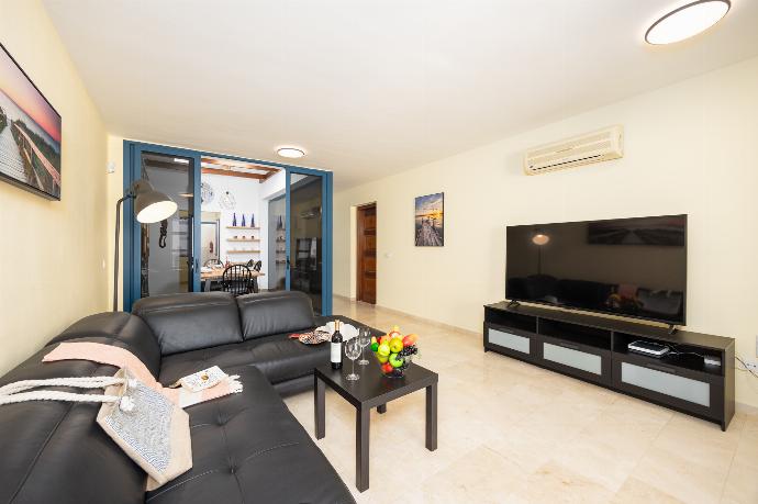 Living room with sofa, A/C, WiFi internet, and satellite TV . - Villa Concha . (Photo Gallery) }}