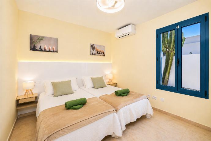 Twin bedroom with A/C . - Villa Concha . (Photo Gallery) }}