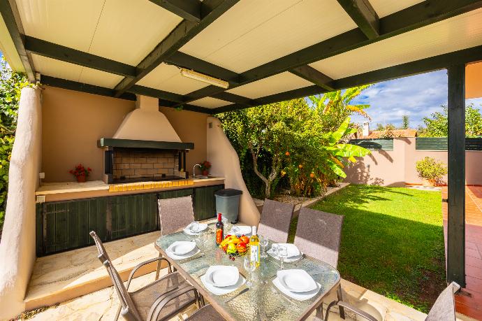 Sheltered terrace area with BBQ . - Aloni Villa . (Photo Gallery) }}