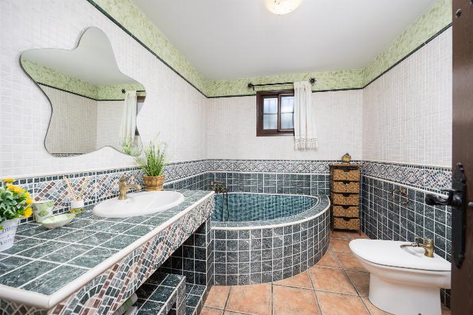 Family bathroom with bath and shower . - Villa Baena . (Photo Gallery) }}
