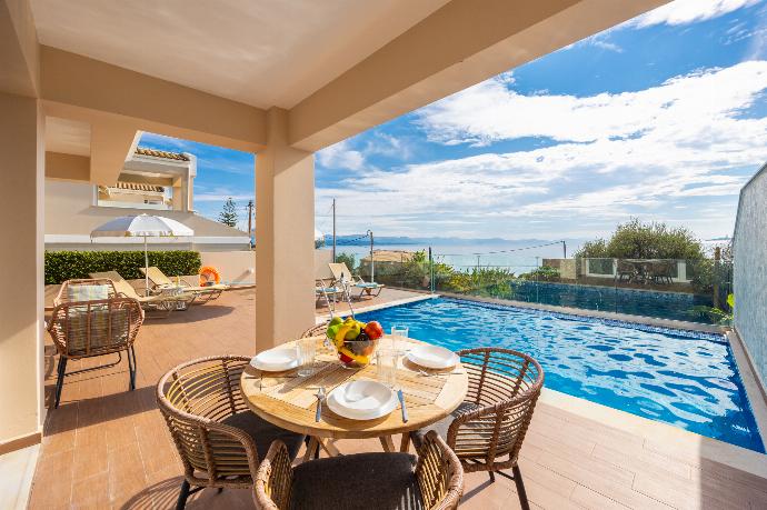 Sheltered terrace area with sea views . - Villa Damian . (Photo Gallery) }}