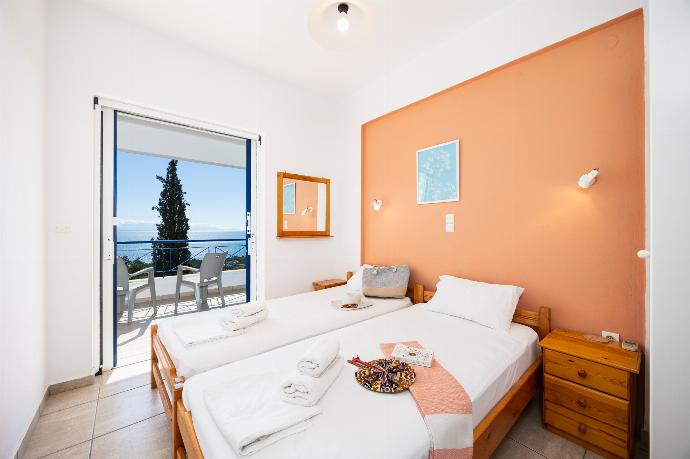 Twin bedroom with A/C and sea views . - Villa Cleo . (Photo Gallery) }}