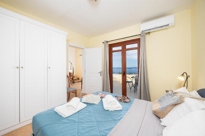 Double bedroom with shared en suite bathroom, A/C, and sea views . - Villa Aphrodite . (Photo Gallery) }}