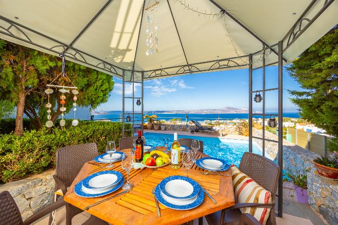 Sheltered terrace area with sea views . - Villa Ikaros . (Photo Gallery) }}