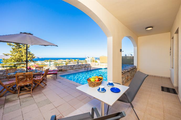 Sheltered terrace area with sea views . - Odysseus Villa . (Photo Gallery) }}