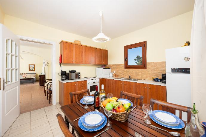 Equipped kitchen with dining area . - Odysseus Villa . (Photo Gallery) }}