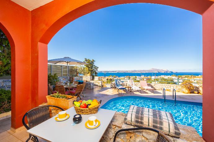 Sheltered terrace area with sea views . - Villa Persephone . (Photo Gallery) }}