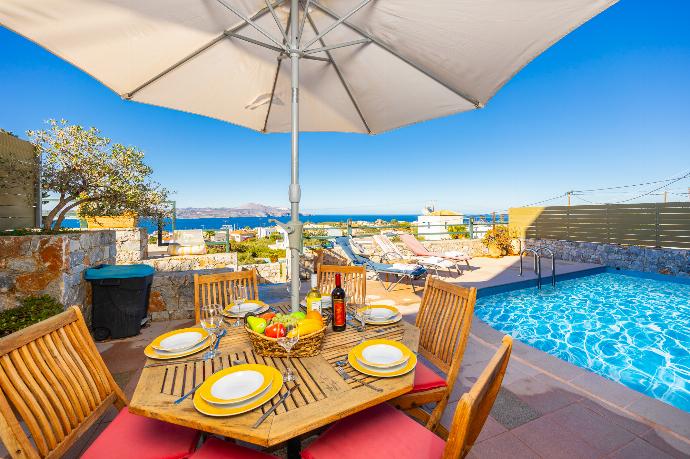 Terrace area with sea views . - Villa Persephone . (Photo Gallery) }}