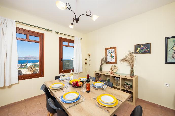 Living room with sofa, dining area, ornamental fireplace, A/C, WiFi internet, and satellite TV . - Villa Persephone . (Photo Gallery) }}