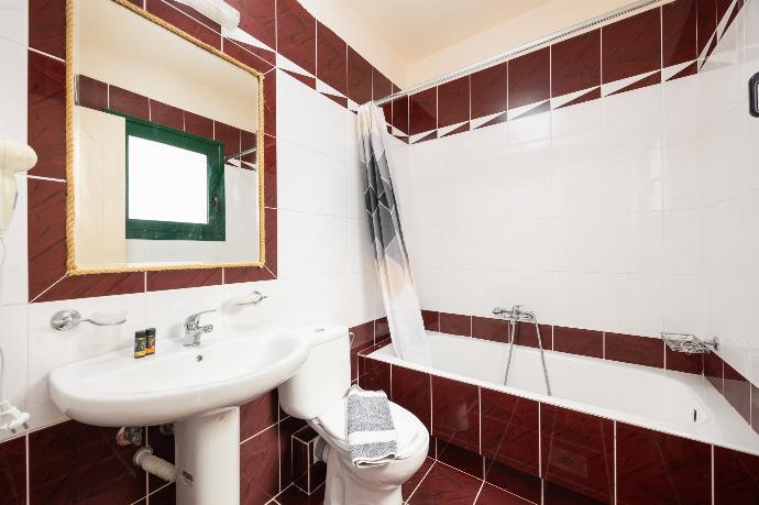 Family bathroom with bath and shower . - Villa Phedra . (Photo Gallery) }}