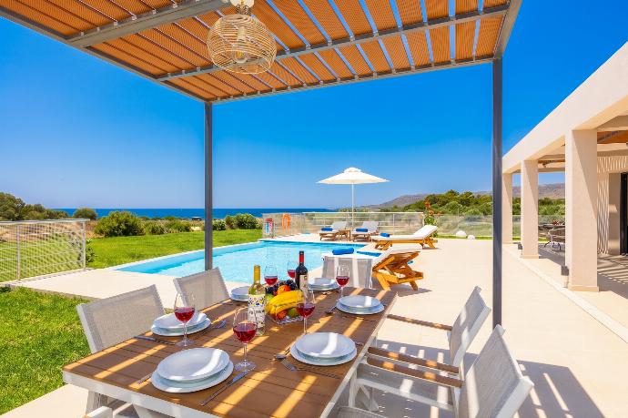 Sheltered terrace area with sea views . - Villa Pinelopi Tria . (Galleria fotografica) }}
