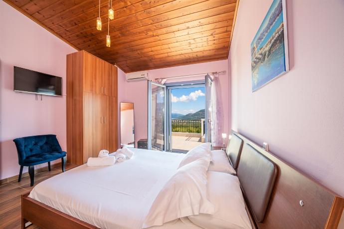 Double bedroom with A/C . - Sunrise Villa . (Photo Gallery) }}