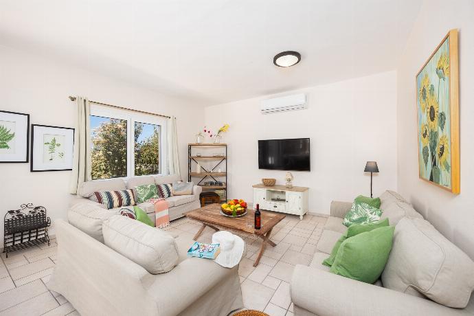 Living room with sofas, A/C, WiFi internet, and satellite TV . - Villa Korini . (Photo Gallery) }}