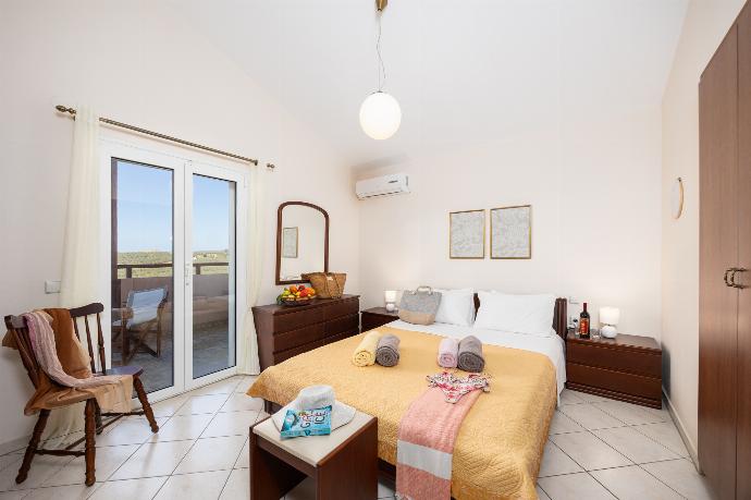 Double bedroom with A/C . - Villa Korini . (Photo Gallery) }}