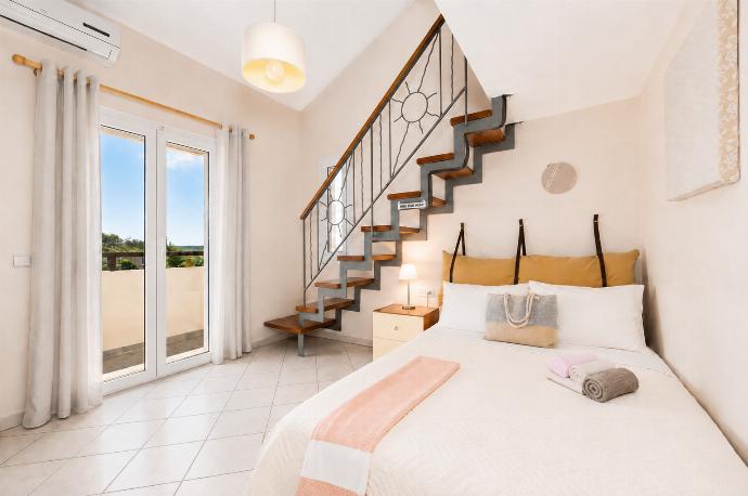 Double bedroom with mezzanine and A/C . - Villa Korini . (Galleria fotografica) }}