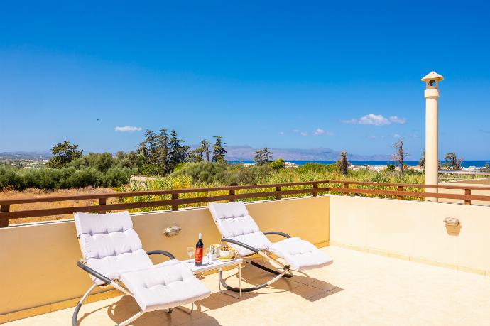 Upper terrace area with sea views