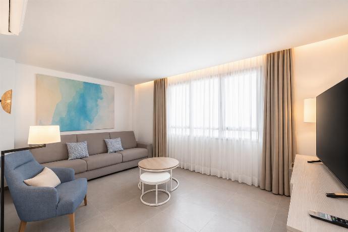 A bright modern living room with elegant neutral decor. . - Ereza Residence 1.4 . (Photo Gallery) }}