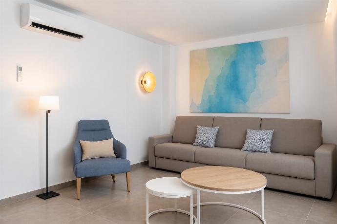 A bright modern living room with elegant neutral decor. . - Ereza Residence 1.4 . (Photo Gallery) }}