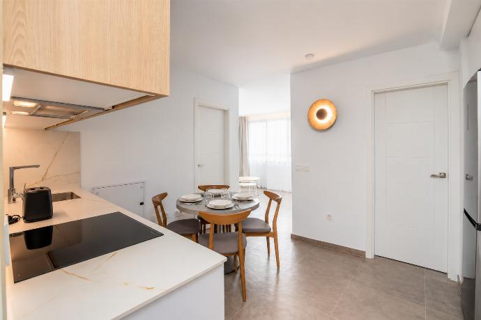 A bright modern living room with soft natural light, elegant neutral decor. . - Ereza Residence 1.4 . (Photo Gallery) }}
