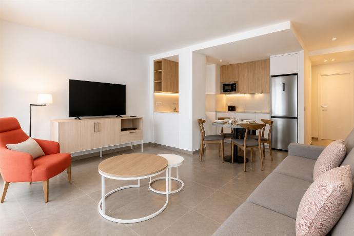 ,A bright modern open-plan apartment with elegant living, dining, and kitchen areas. . - Ereza Residence 2.1 . (Photo Gallery) }}