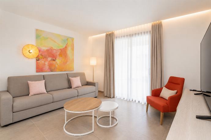 A bright modern living room with elegant neutral decor. . - Ereza Residence 2.2 . (Photo Gallery) }}