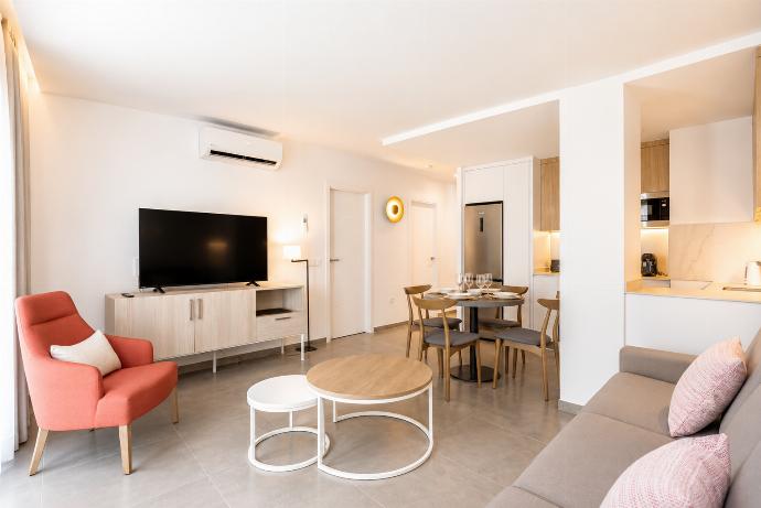 ,A bright modern living room with soft natural light, elegant neutral decor. . - Ereza Residence 2.2 . (Photo Gallery) }}