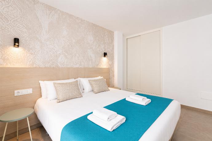 Bright double bedroom with elegant neutral decor and a spacious built-in wardrobe. . - Ereza Residence 2.2 . (Photo Gallery) }}
