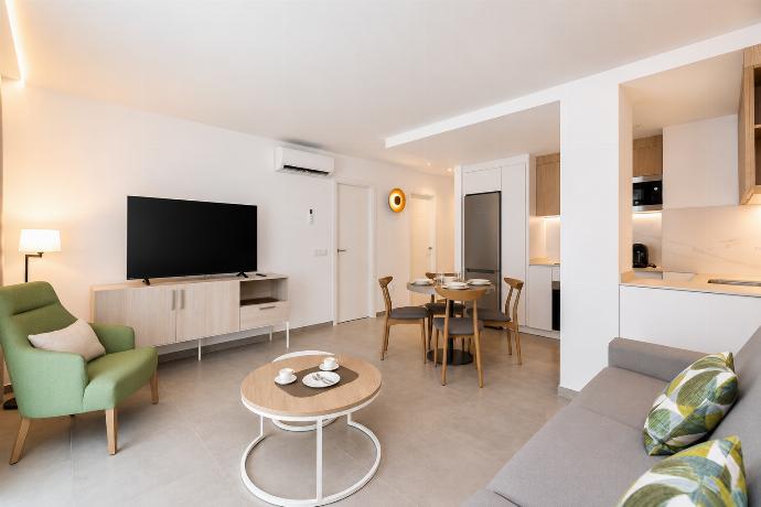 ,A modern open-plan living and dining area with elegant neutral decor. . - Ereza Residence 3.2 . (Photo Gallery) }}