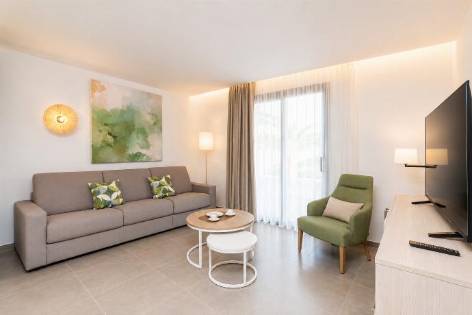 A modern open-plan living and dining area with elegant neutral decor. . - Ereza Residence 3.2 . (Photo Gallery) }}