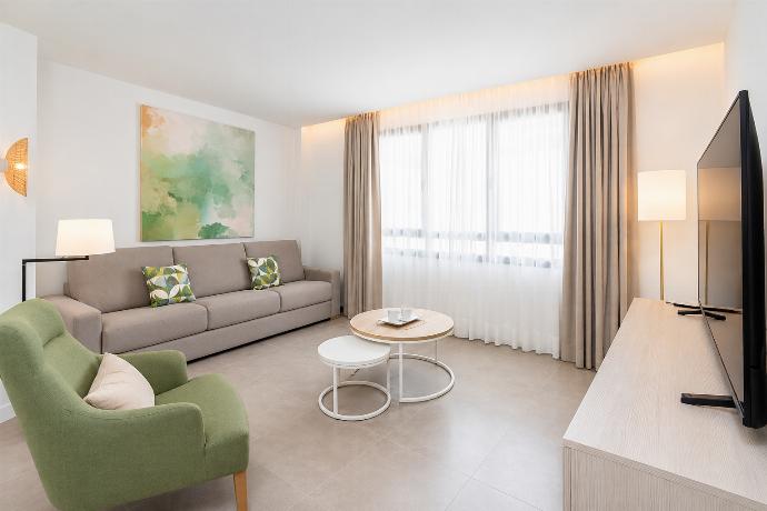 Open-plan living room with sofa, kitchen, A/C, WiFi and TV . - Ereza Residence 3.4 . (Photo Gallery) }}