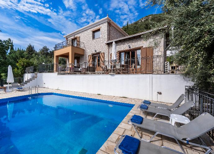 Private outdoor swimming pool with grey sun loungers and a multi-level stone villa terrace. . - Villa Galatia . (Photo Gallery) }}