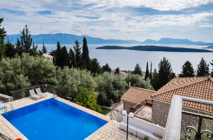 Stone terrace and swimming pool area overlooking a panoramic island bay. . - Villa Galatia . (Photo Gallery) }}