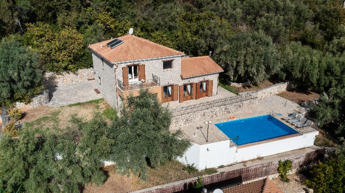 Aerial view of a two-story stone villa with a private swimming pool and paved terrace. . - Villa Galatia . (Photo Gallery) }}