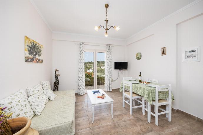 Ground floor: open-plan living room with sofa, dining area, kitchen, WiFi internet, and satellite TV . - Dolphin House . (Photo Gallery) }}