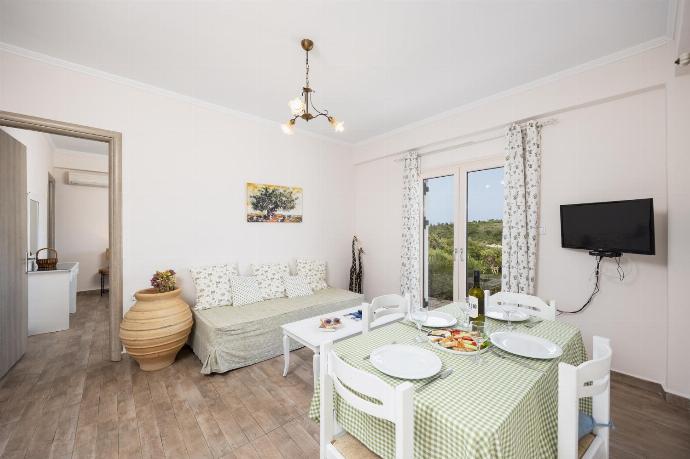 Ground floor: open-plan living room with sofa, dining area, kitchen, WiFi internet, and satellite TV . - Dolphin House . (Photo Gallery) }}